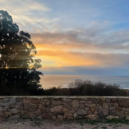 Tiny House With Sunset Over The Ocean