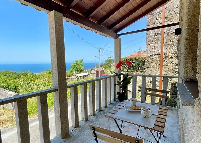 Tiny House With Sunset Over The Ocean Oia