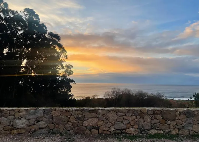 Tiny House With Sunset Over The Ocean